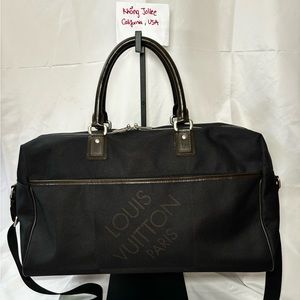 Black Damier Geant Albatross Duffel with strap.